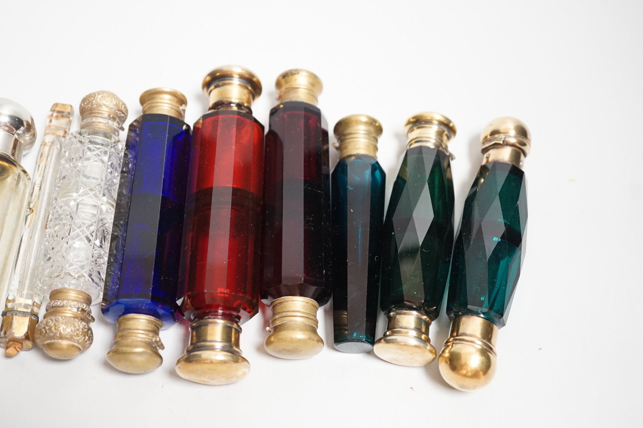 Seven 19th century coloured glass double ended scent bottles and three others